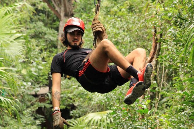 ATV Adventure Combo with Snorkeling, Ziplines, Cenote, and Lunch - Ziplining above the adventure park