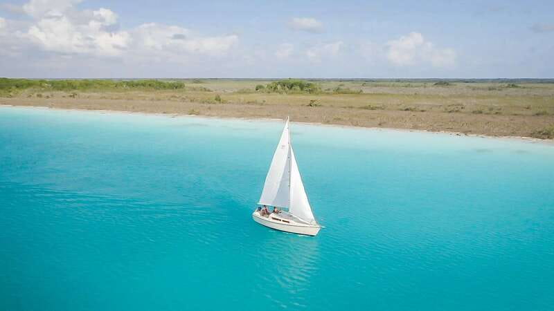 Bacalar: Group Sailing Trip with Swimming and Drinks - Cenote Esmeralda and the first stretch of open water
