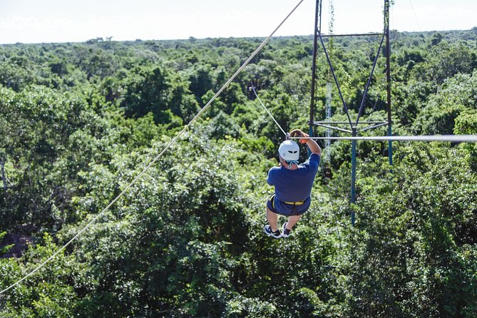 Cancun Extreme Zipline Canopy Tour - The first harness and the long climb upward