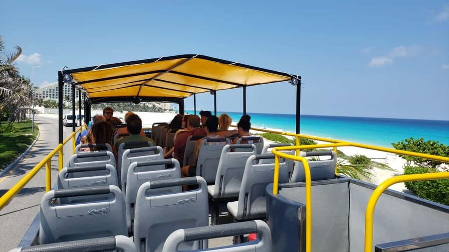 Cancun: Guided City Tour with Shopping by Double Decker Bus - Boulevard Kukulcan from the upper deck