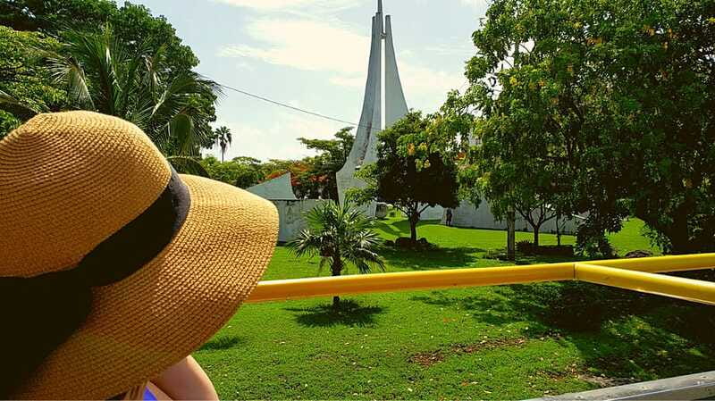 Cancun: Guided City Tour with Shopping by Double Decker Bus - Playa Delfines and the Cancun sign