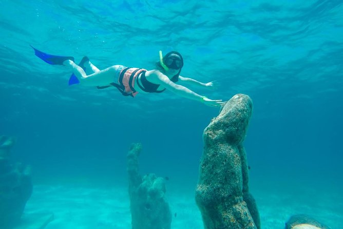 Cancun Half-Day Sailing Catamaran Cruise to Isla Mujeres - A five-hour sailing trip with a party-boat pulse