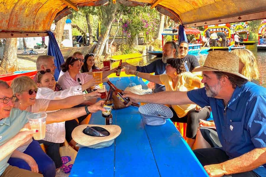 CDMX: Xochimilco Trajinera Party, Drinks, Mariachi & Tacos - Boarding a decorated trajinera