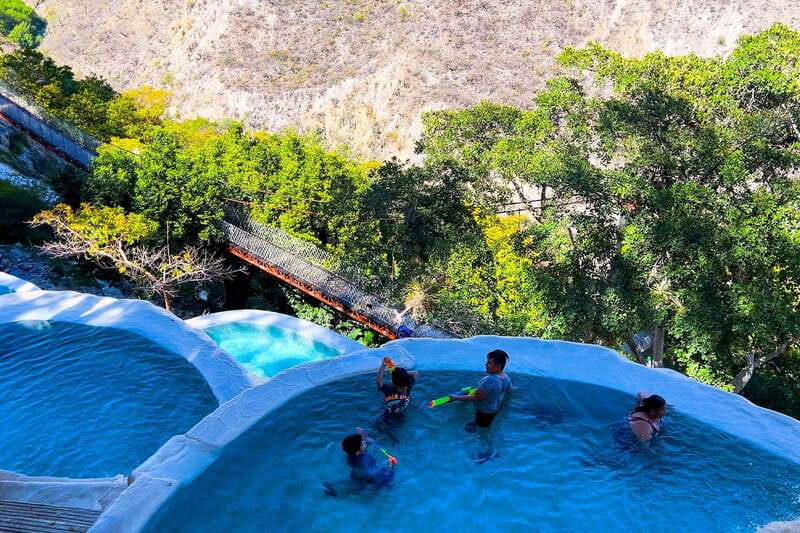 From Mexico City: Tolantongo Hot Springs Day Trip with Guide - Suspension bridge, trails, and mountain views