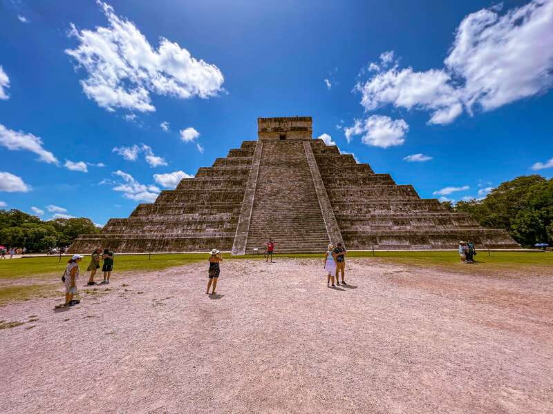 From Riviera Maya: Chichen Itza, Cenote, and Valladolid Tour - Entering Chichen Itza before the heat