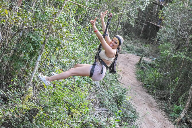 Half Day in Cancun Atvs Ziplines and Cenote Park - ATV riding on a rough jungle track