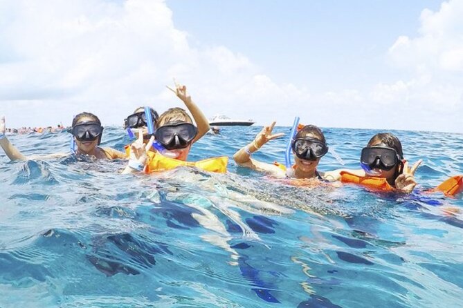 Isla Mujeres Catamaran Tour with Snorkel, Open bar and Transport - A lively start at Playa Tortugas