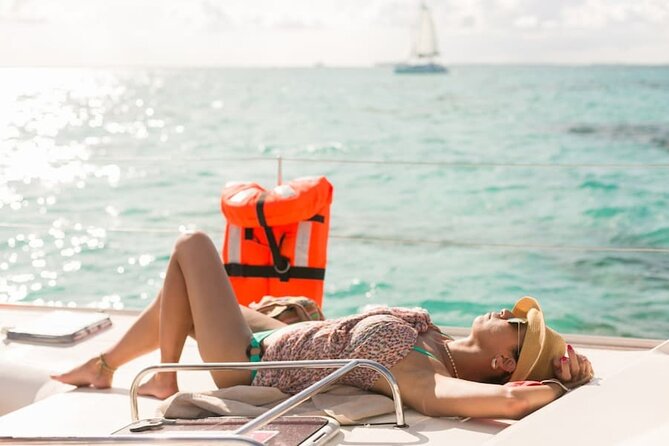 Isla Mujeres Catamaran Tour with Snorkel, Open bar and Transport - Sailing across the Caribbean