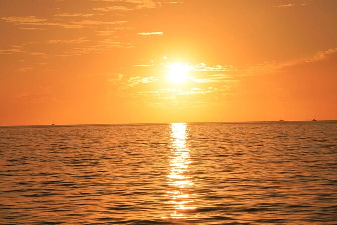 Los Cabos Catamaran Cruise with Open Bar & Light Snack - Unlimited Drinks, Simple Snacks, and a Party Mood