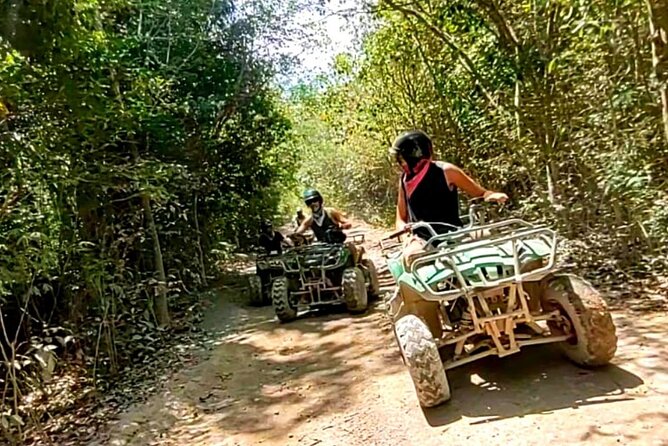 Maya Adrenaline Tulum: Cenote + 5 Ziplining + ATV Adventure - Riding an ATV on the jungle road