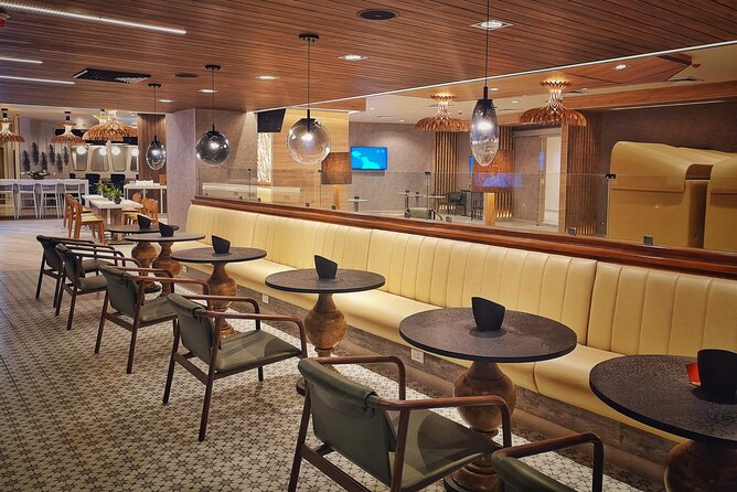 Mera VIP Lounge at Cancun International Airport - Inside Terminal 3: food, drinks, and a place to sit