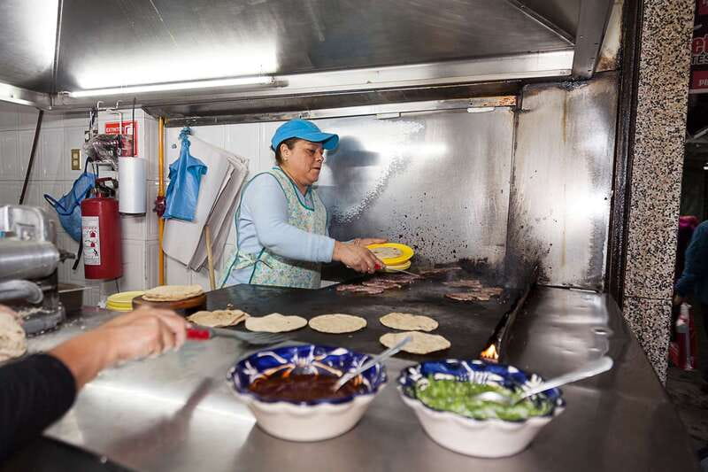Mexico City: Tacos & Mezcal Night Food Tour - Riding through four neighborhoods after dark