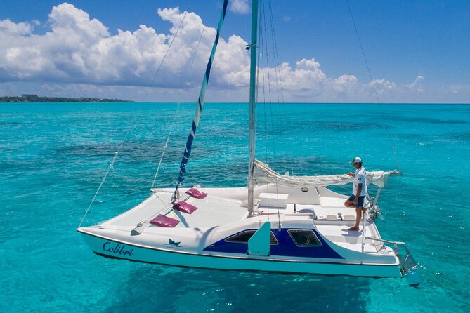 Premium Isla Mujeres Tour by Private Catamaran - Sailing toward El Meco reef