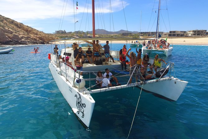 Private Catamaran Snorkeling Cruise in Los Cabos - Food, drinks, music, and crew service