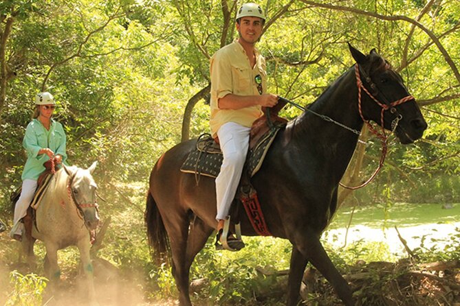 Tulum Jungle Horseback Ride + ATV + Ziplines + Cenote Combo Tour - Swimming through the underground cenote
